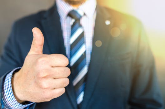 Man giving thumbs up at the office